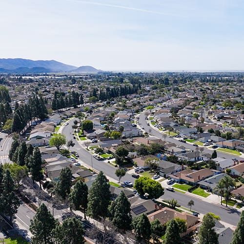 Aerial view of suburban neighborhood in Camarillo California with houses and trees.