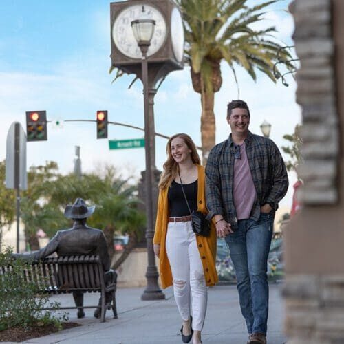 happy couple walking in oldtown camarillo